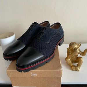 Authentic Christian Louboutin Red button Shoe.